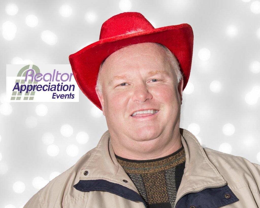 Guest wearing a red hat and novelty bow tie in the archived photo booth