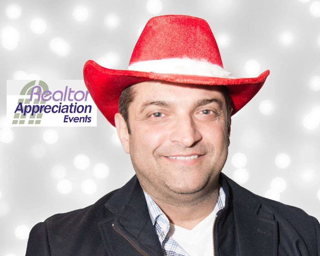Guest wearing a red cowboy hat and tie in the archived photo booth