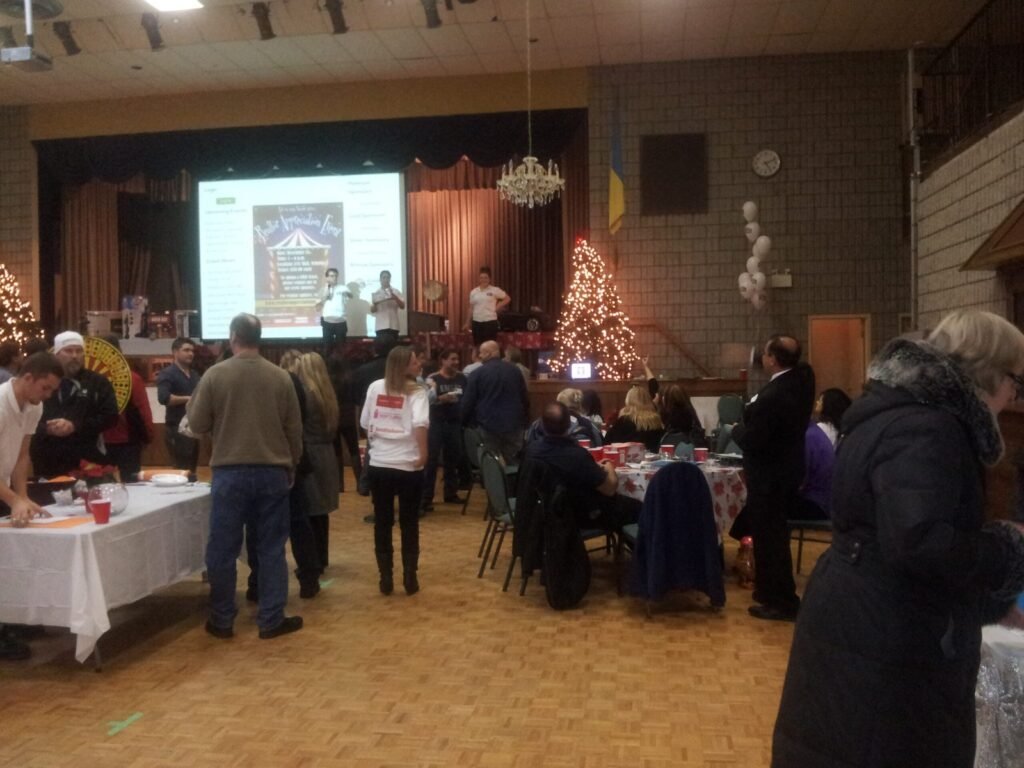 Guests mingling in a hall during an archived community event