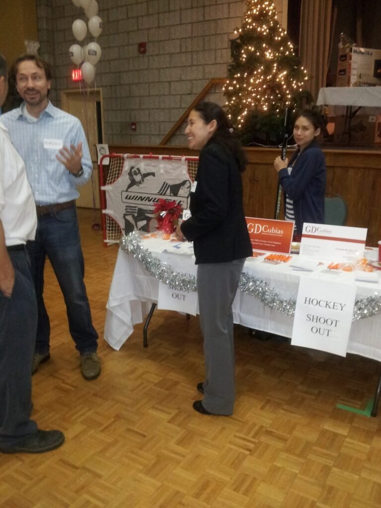 Guests talking near a display in an archived event hall