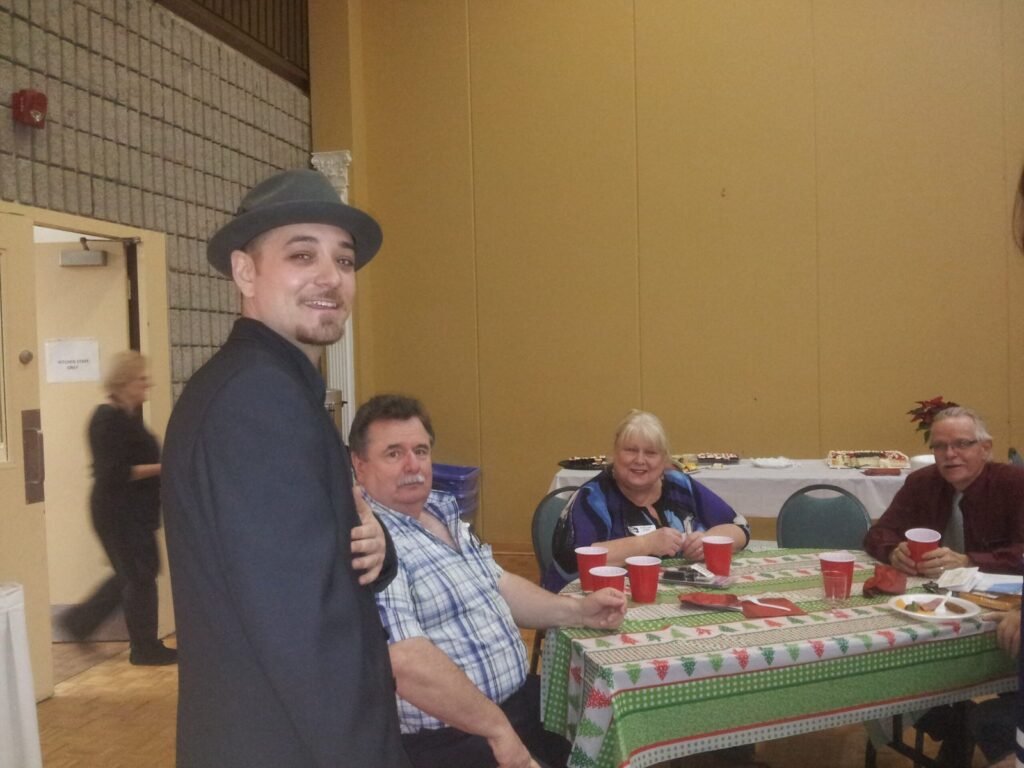 Attendee beside a tabletop activity in the event photo archive