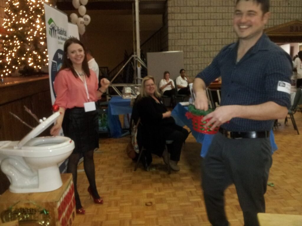 Guests standing near a buffet at an archived gathering